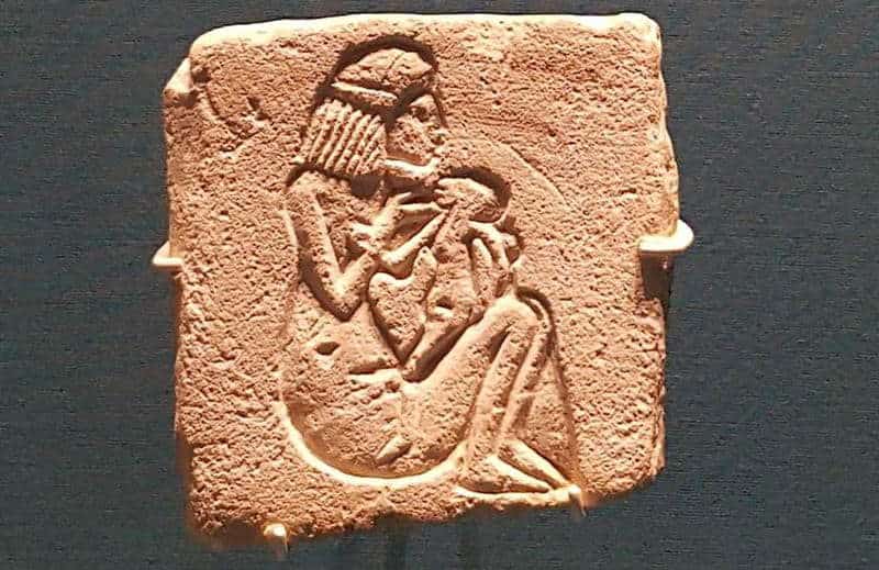 Woman nursing her baby, via Ancient