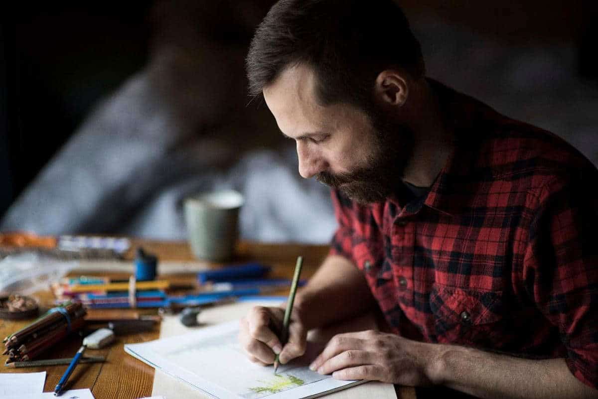 Former Artist-in-Residence, Brooks Salzwedel, working on a drawing during his residency, via NPS