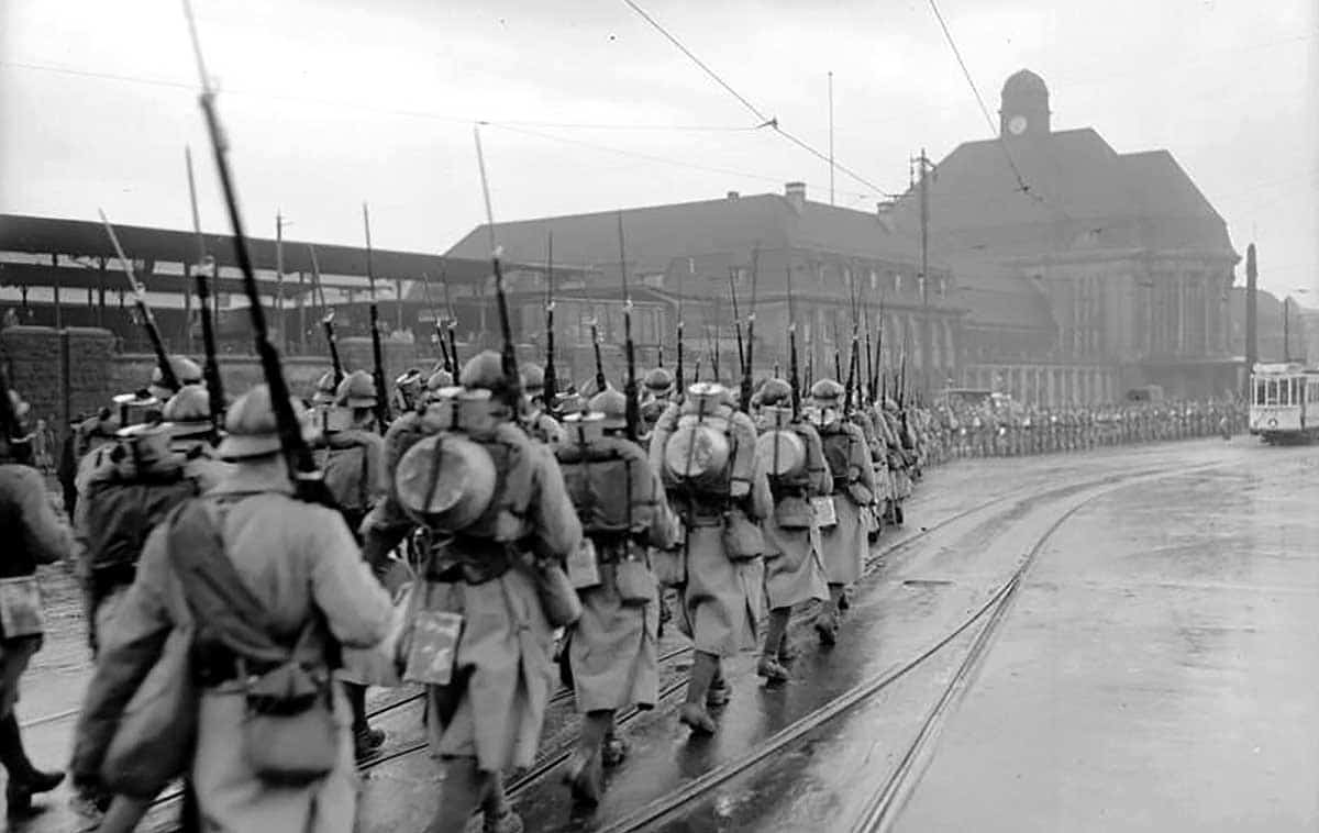 french soldiers marching city