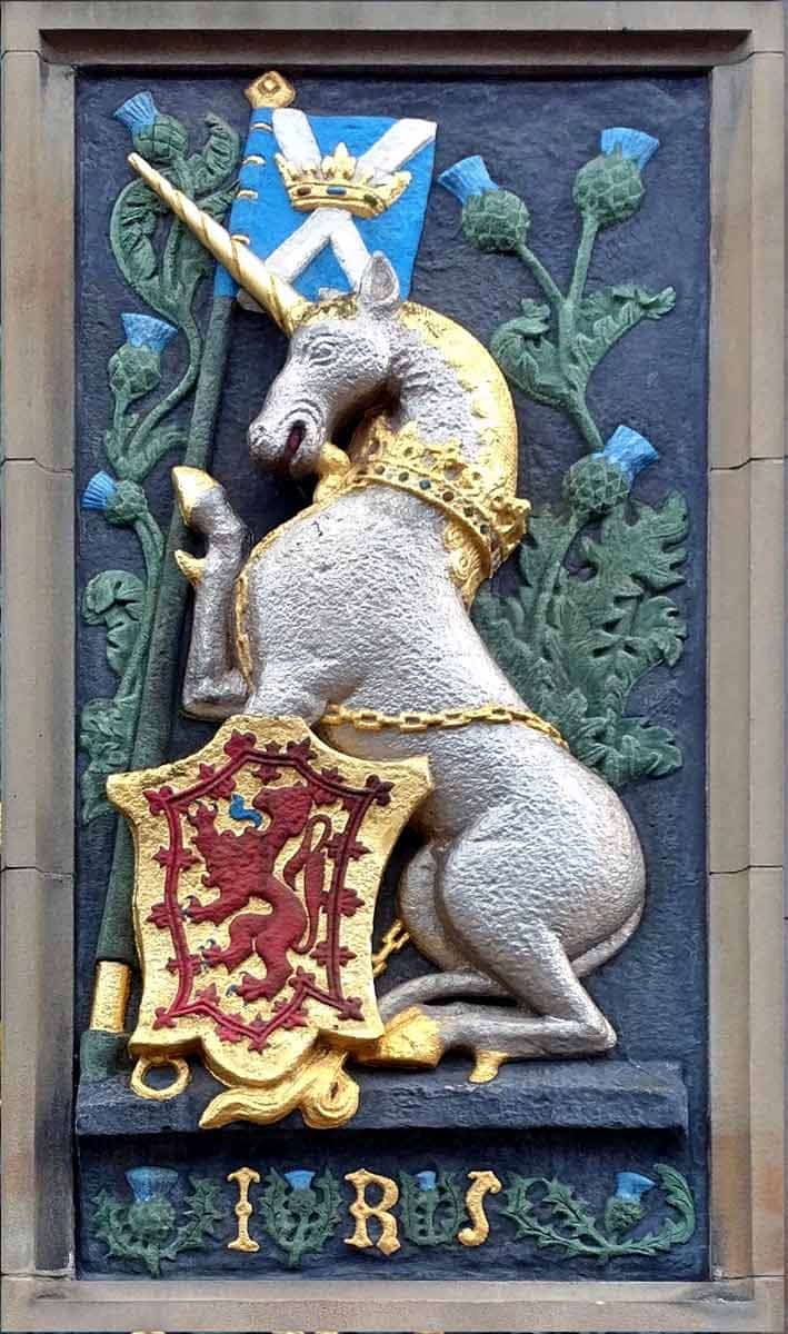 The Scottish unicorn. Seen here adorning the heraldic panel of James V at the gatehouse of Holyrood Palace, via Wikimedia Commons. 