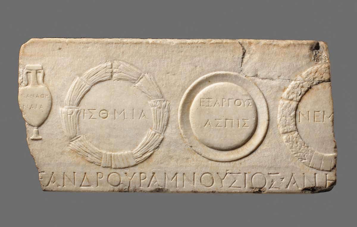 A fragment of a marble relief depicting athletic prizes, the Isthmian wreath on the left