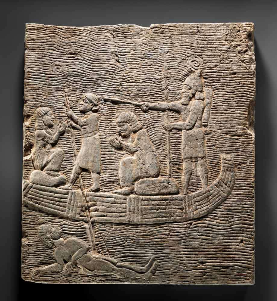 assyrian soldier ferrying captives boat